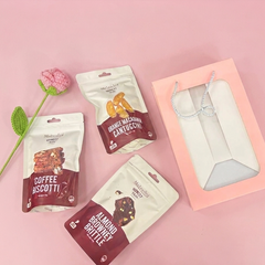 Gift bag with product packaging on a pink background